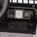Kids ride-on car dashboard with speed controls, remote manual switch, and Bluetooth USB panel visible.