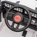 Jeep ride-on toy car dashboard with black steering wheel and control buttons shown close up.