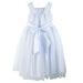 White flower girl dress with tulle skirt and large satin bow, displayed on a plain background.