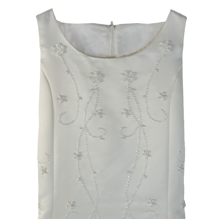 Flower girl party dress in ivory shown close-up with floral beaded details on bodice.
