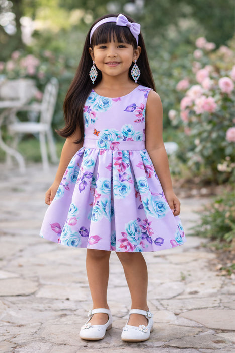 Roses Butterflies Silky Dress lilac shown on a young girl standing outdoors in a garden setting.