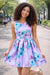 Roses Butterflies Silky Dress in lilac with blue floral and butterfly print, worn outside on a sunny day.