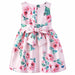Girls' pink silky dress with rose and butterfly print, shown from the back with a large bow detail.