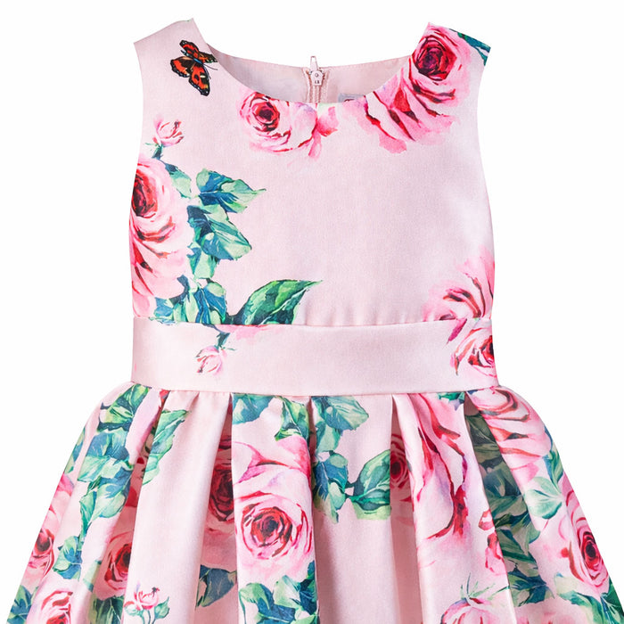 Kids silky pink dress with roses and butterfly print shown on a flat white background.