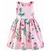 Pink silky dress with rose and butterfly print displayed on a plain white background.