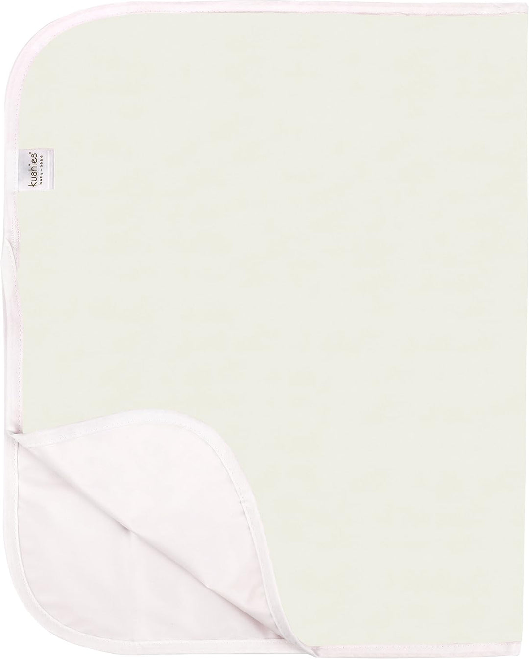 White waterproof baby changing pad with soft pink trim and corner tag, unfolded