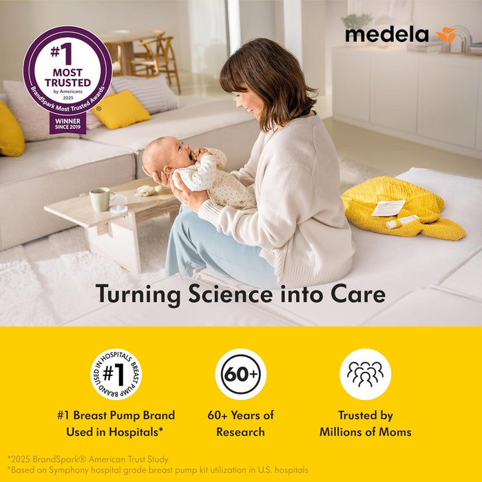 Medela breast pump ad showing a mother holding her baby in a bright, cozy living room setting.