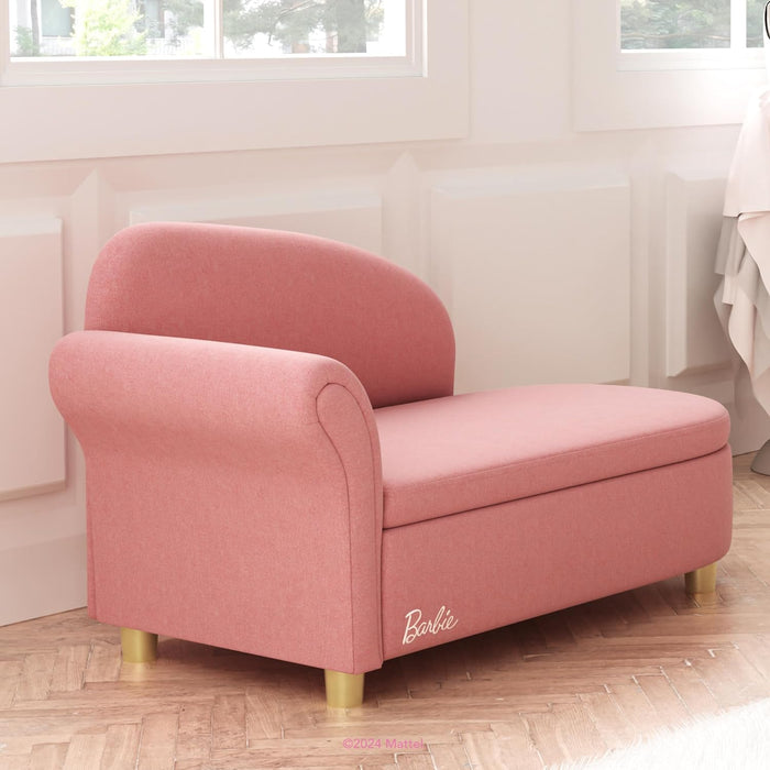 Pink Barbie kids chaise lounge chair with gold legs in a bright playroom setting