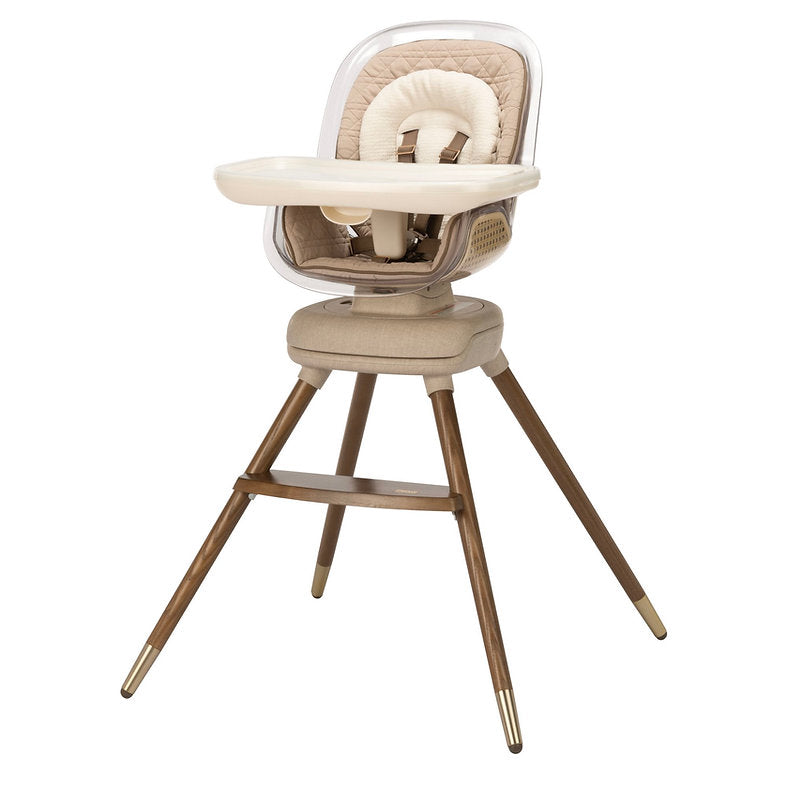 Modern beige baby high chair with wooden legs, adjustable tray, and padded seat