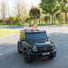 Mercedes-Benz DK-G63 kids ride-on car with two children driving outdoors on a paved path.