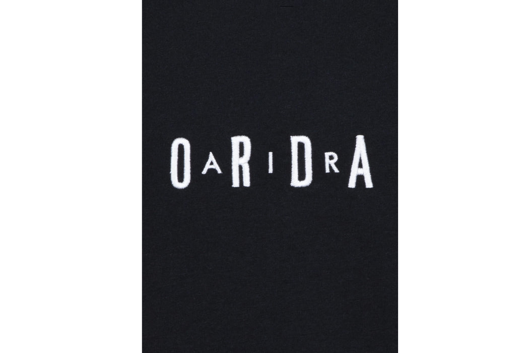 Black kids' shirt with white embroidered letters spelling 'OARIDRA' on the chest.