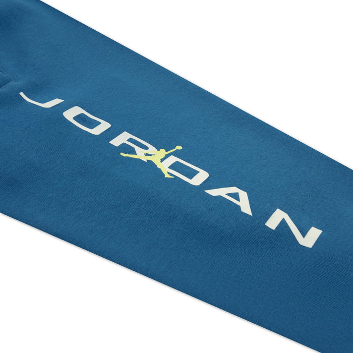 Jordan kids' blue sweatshirt sleeve showing white logo and yellow Jumpman graphic.