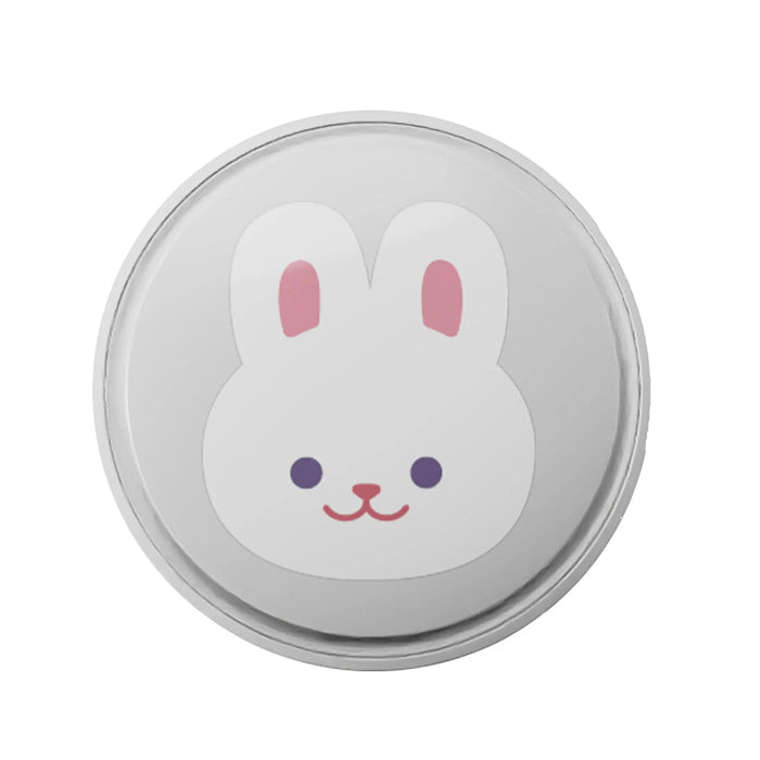 Round pink kids pacifier clip with cute bunny face design shown on a white background.