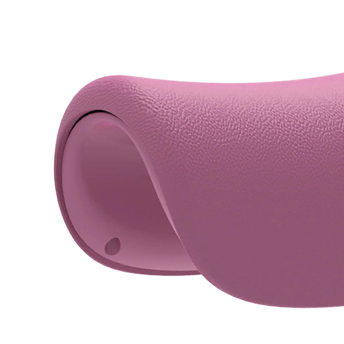 Pink textured baby booster seat close-up showing curved ergonomic design.
