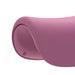 Pink textured baby booster seat close-up showing curved ergonomic design.