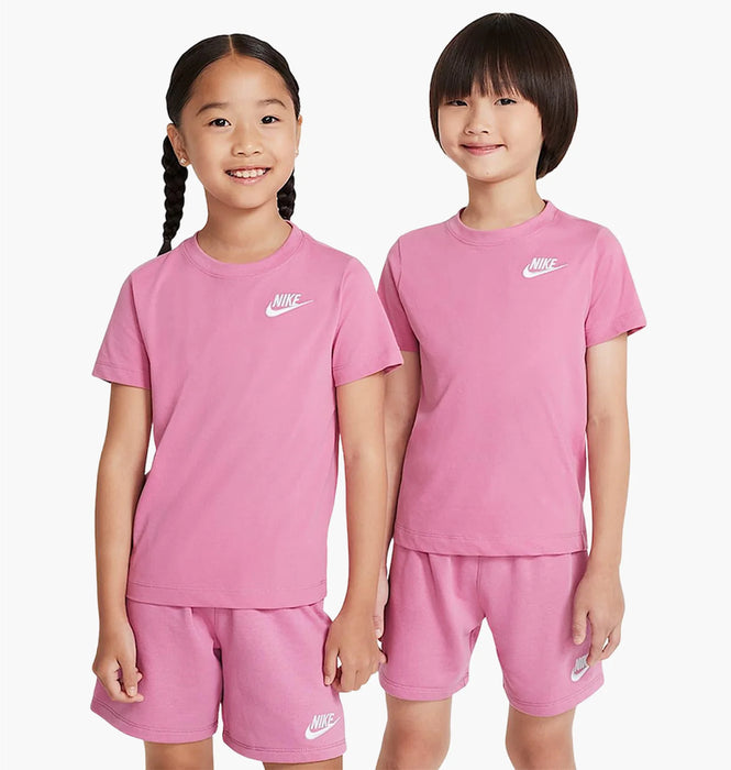 Nike kids' pink t-shirt and shorts sets worn by two children standing against a white background.