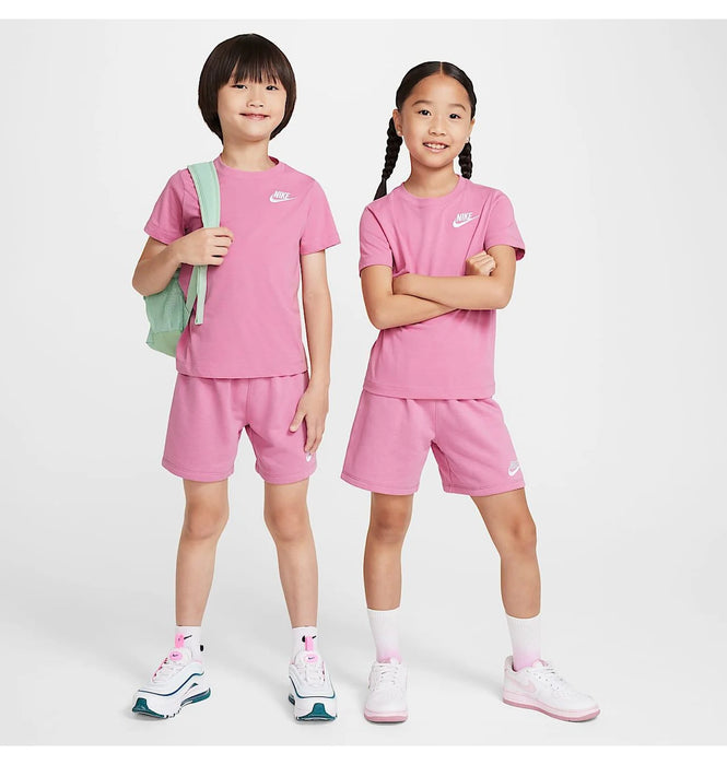 Nike kids' pink t-shirt and shorts set modeled by two children standing against a white background.