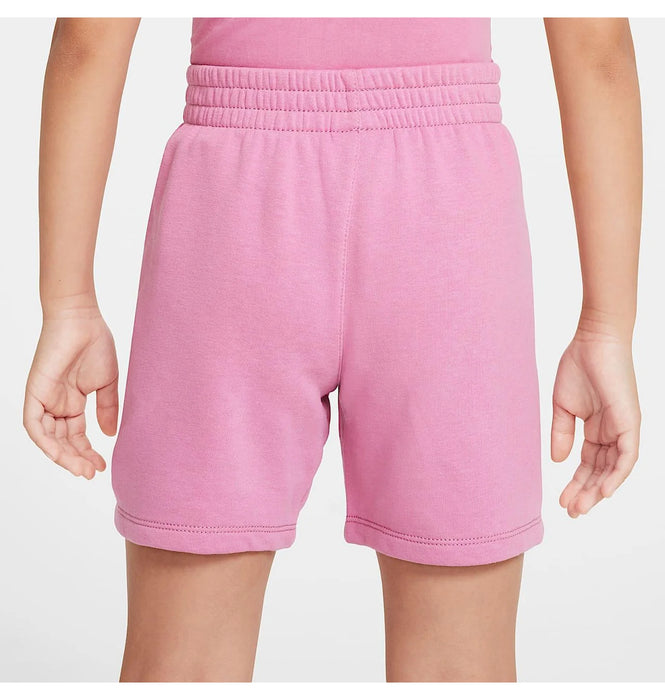 Pink elastic waist kids shorts shown on a child, photographed from the back against a plain background.