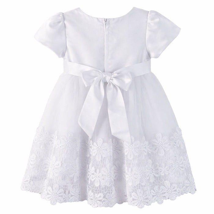 Baby white dress with lace trim and satin bow, displayed flat against a white background.