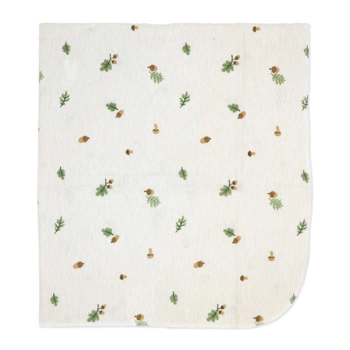 Muslin baby blanket with green leaves and acorn print shown flat against a white background.