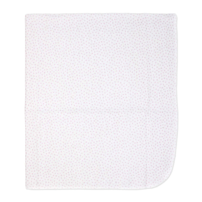White baby blanket with small pink floral print laid flat on a plain background.
