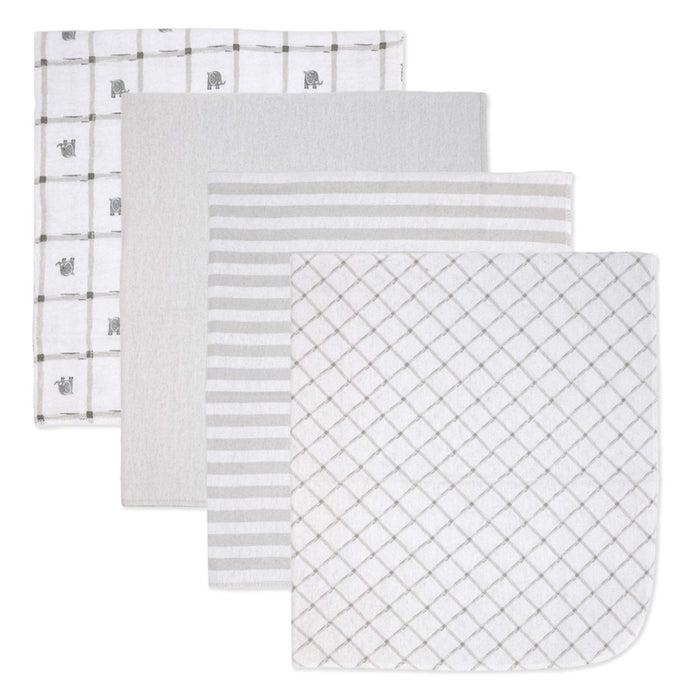 Set of four baby muslin blankets in neutral patterns, neatly stacked on a white background.