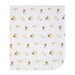 White baby blanket with small brown and beige floral pattern laid flat on a plain background.
