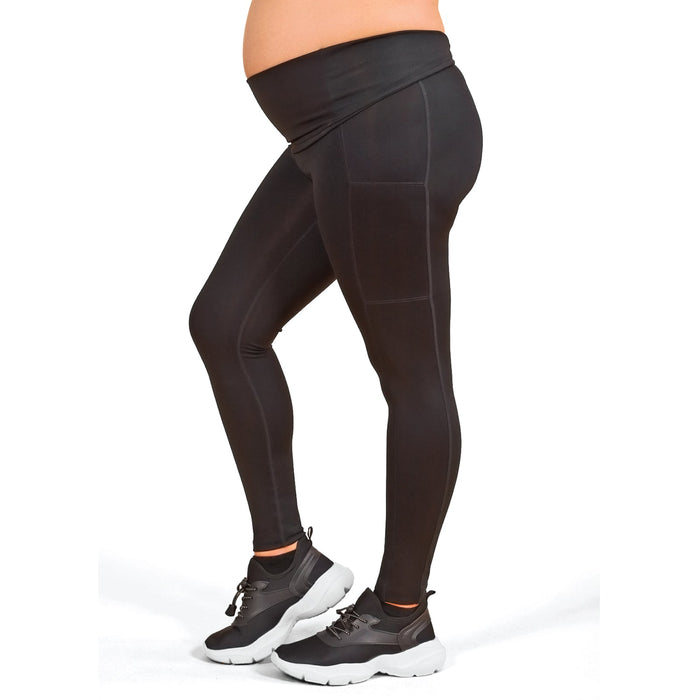 Athena black maternity leggings shown on a person standing, side view, white background.