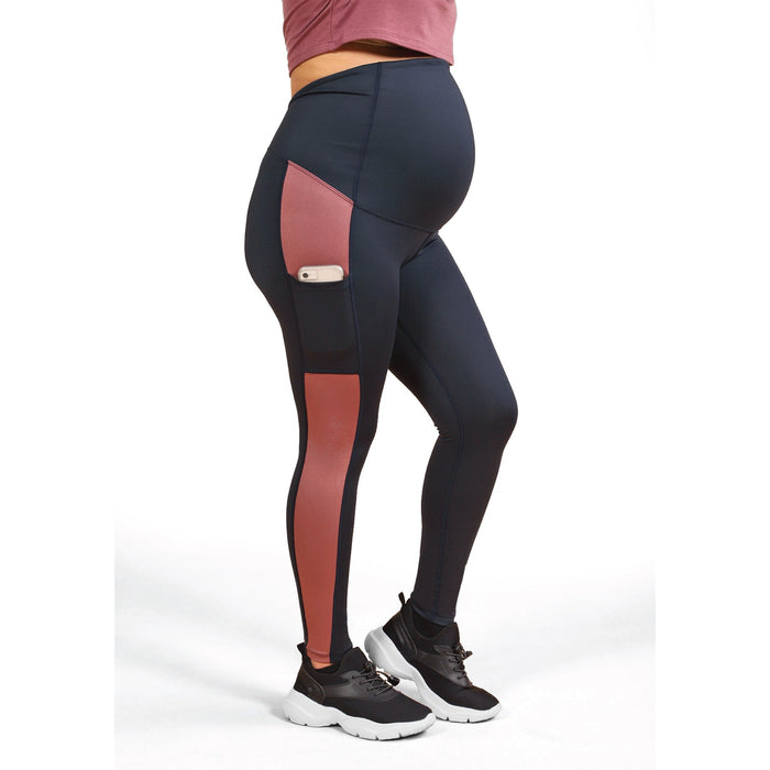 Athena Duo Maternity Leggings shown on a pregnant model with a smartphone in the side pocket.