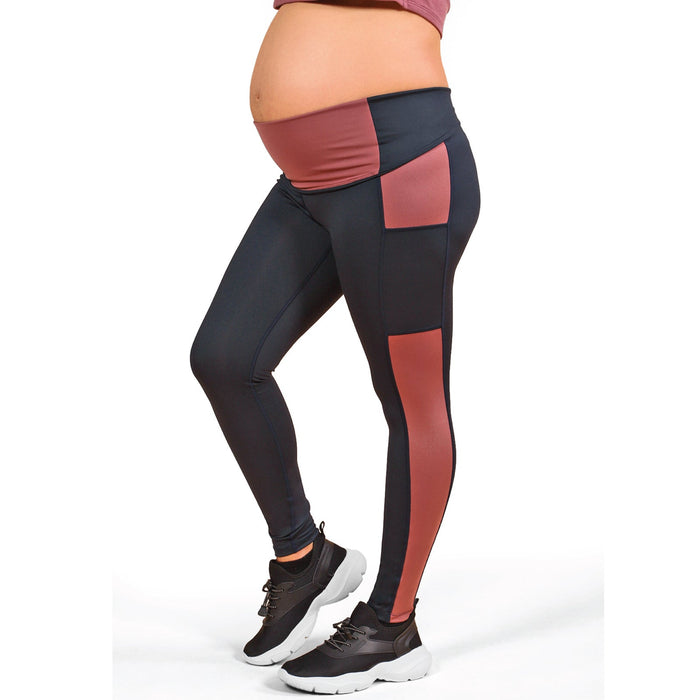 Athena Duo maternity leggings modeled on a pregnant woman, showing color block design on white background.