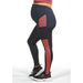 Athena Duo maternity leggings in black with red panels, shown on a pregnant person standing