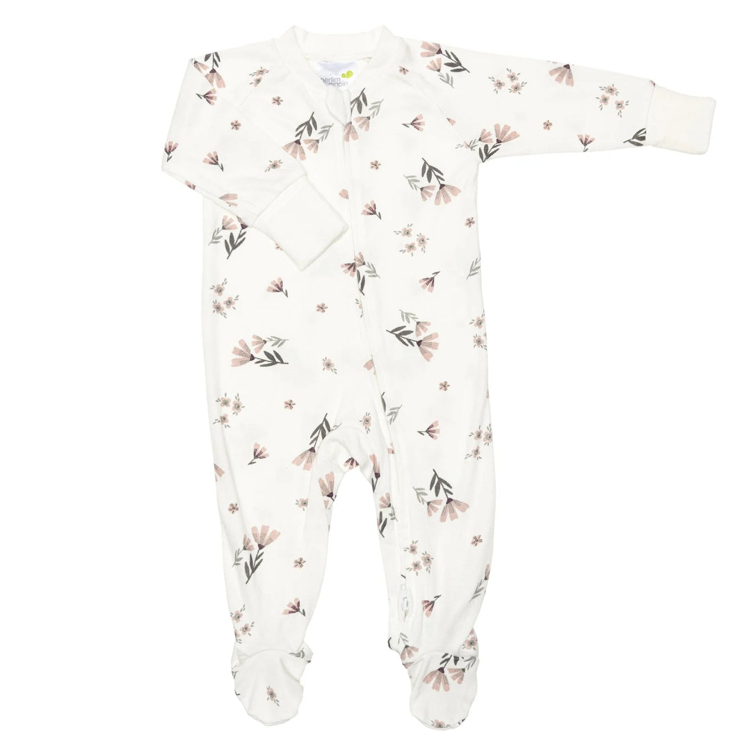 White bamboo baby sleeper pajama with soft pink floral print and zipper closure
