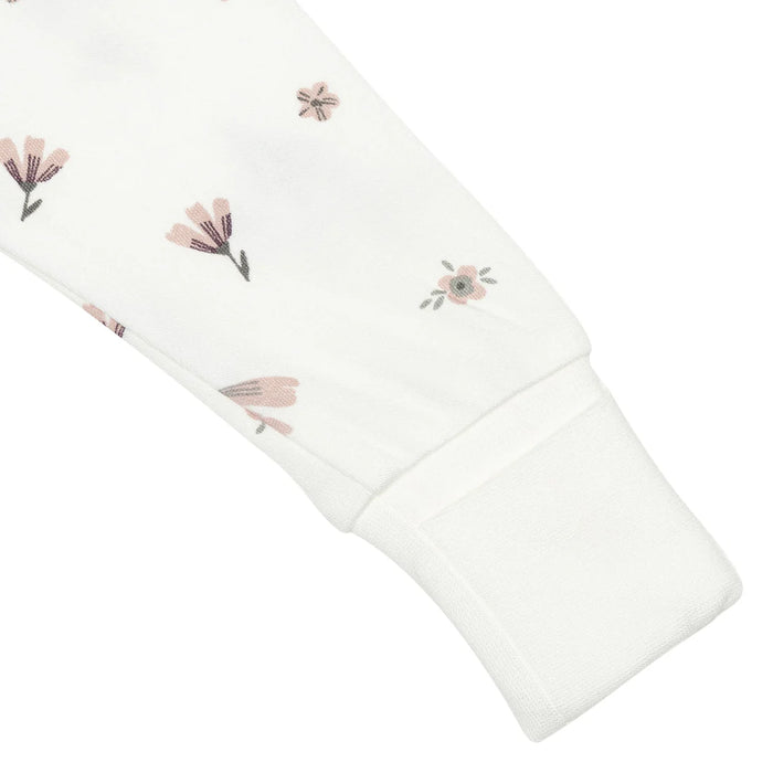 White baby sleeper sleeve with soft pink floral print and ribbed cuff