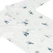A white baby zip-up sleeper with an all-over print of hockey players and sticks in navy blue, gray, and black, shown on a plain white background.