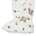 Close-up of white baby sleeper foot with squirrel and acorn print on bamboo fabric
