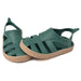 Boatilus Bioty kids green sandals with beige soles displayed side by side on a white background.