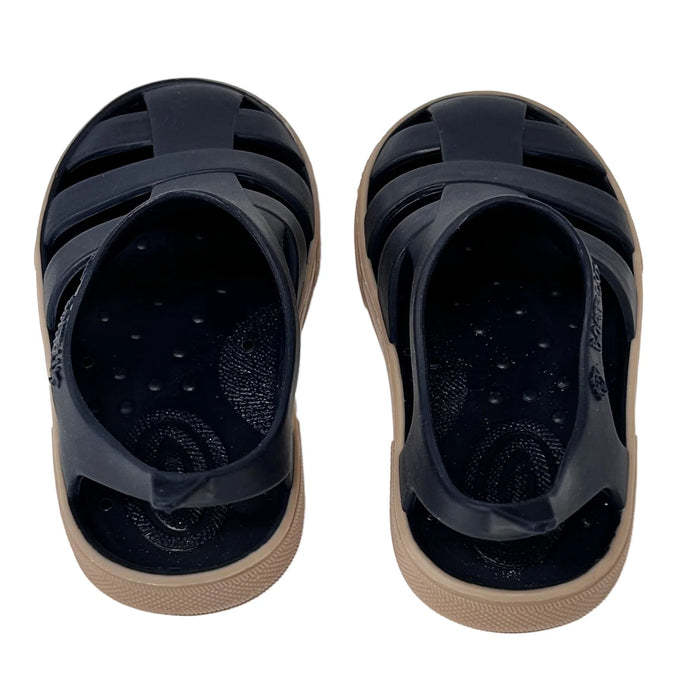 Boatilus Bioty kids sandals in navy blue with tan soles, shown from above on a white background.