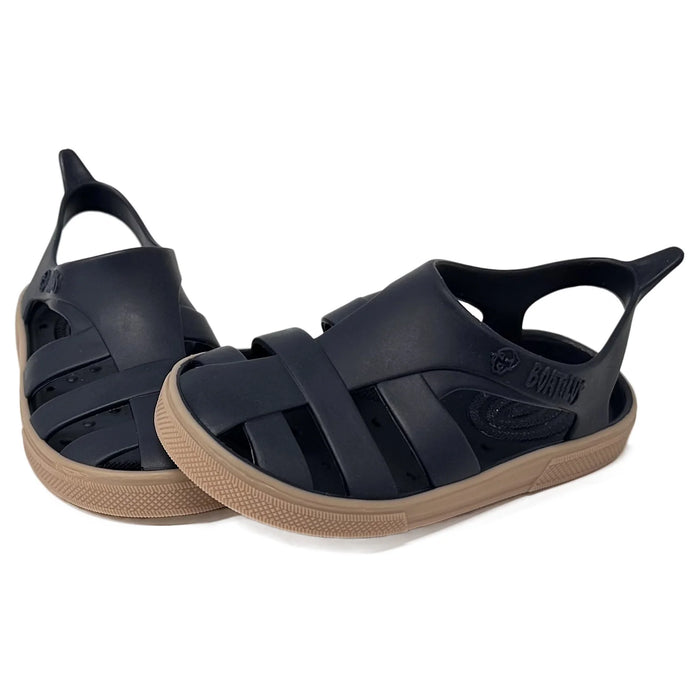 Boatilus Bioty kids sandals in navy with tan soles, displayed on a white background.