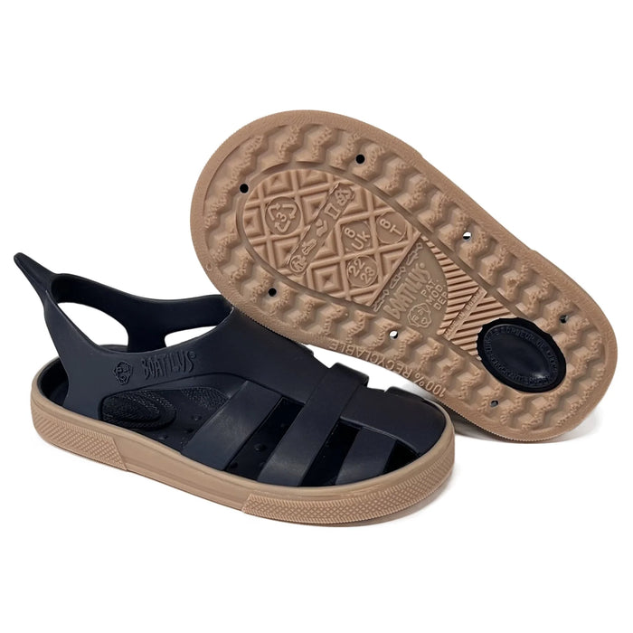Boatilus Bioty kids sandals in black with tan soles displayed on a white background.