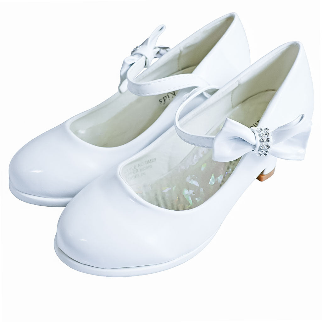 Glossy white bow shoes for girls with rhinestone accents, shown on a plain white background.