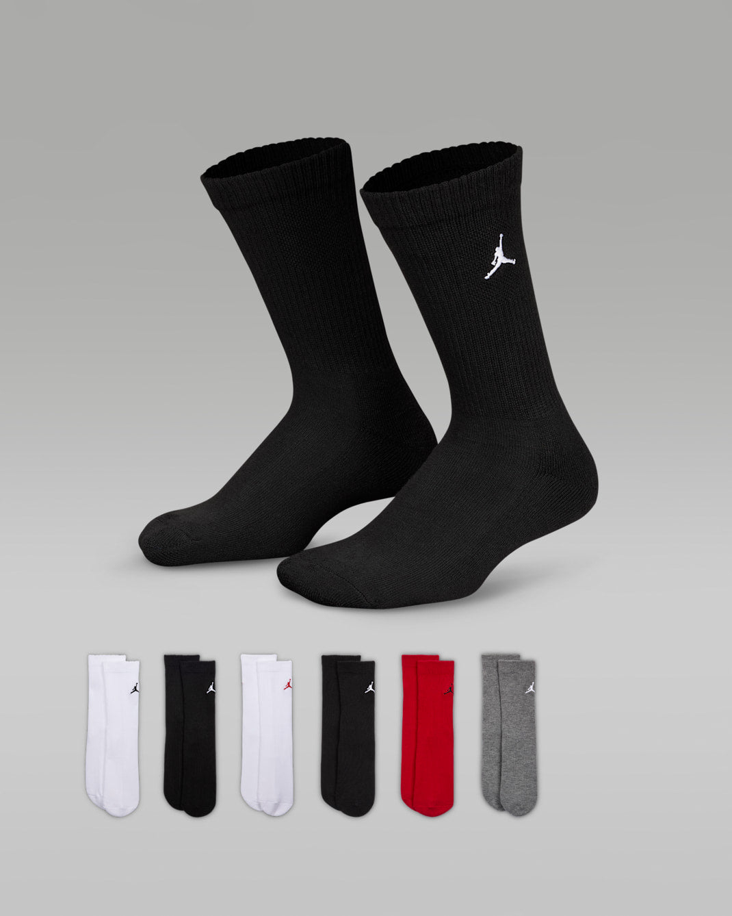 Jordan crew socks 6-pack in assorted colors, displayed on a gray background with pairs laid out below.
