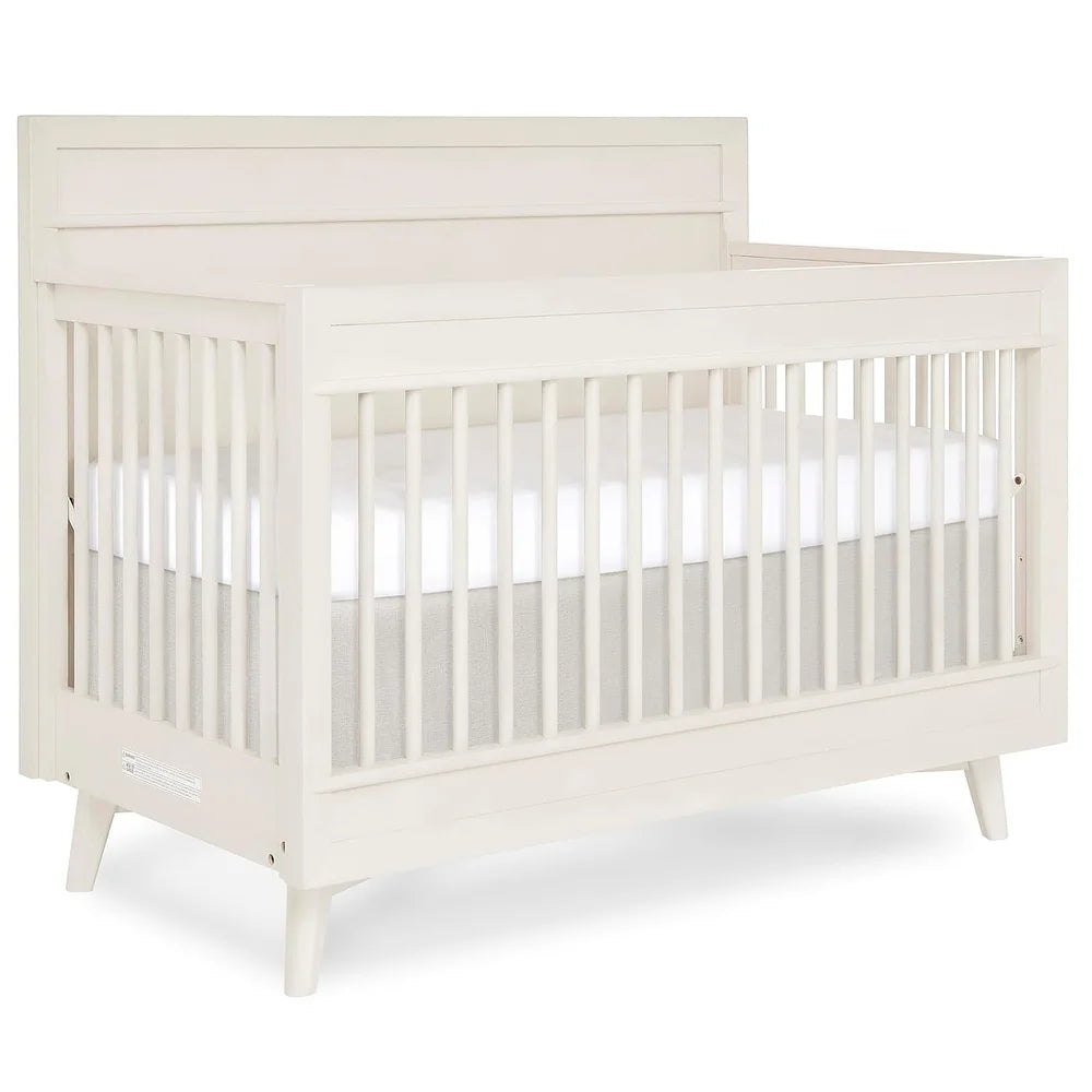 White mid-century convertible baby crib with slatted sides and angled legs