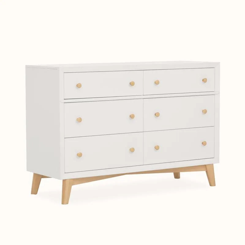 Mid-century modern double dresser with six drawers, white finish, and wood legs for kids room