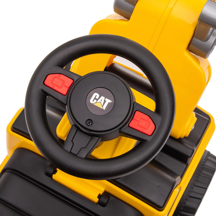 CAT ride-on toy steering wheel and dashboard featuring black and yellow plastic construction.