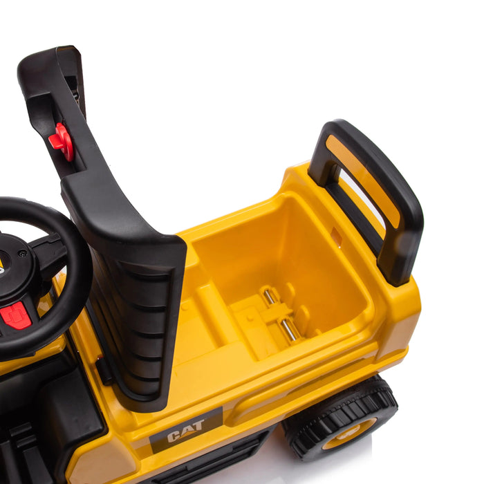 CAT ride-on toy truck top view showing yellow seat, steering wheel, and storage compartment.