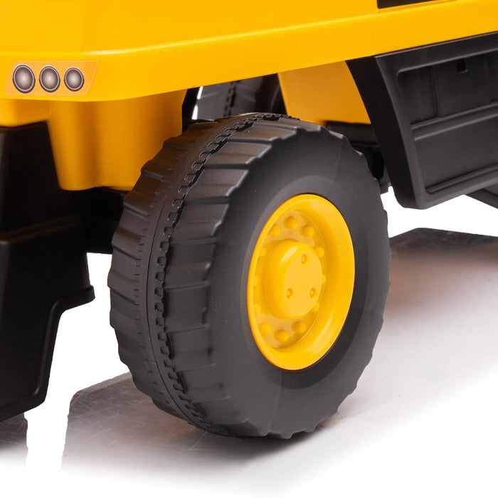 Toy dump truck yellow plastic wheel and body close-up on a white background.