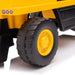 Toy dump truck yellow plastic wheel and body close-up on a white background.