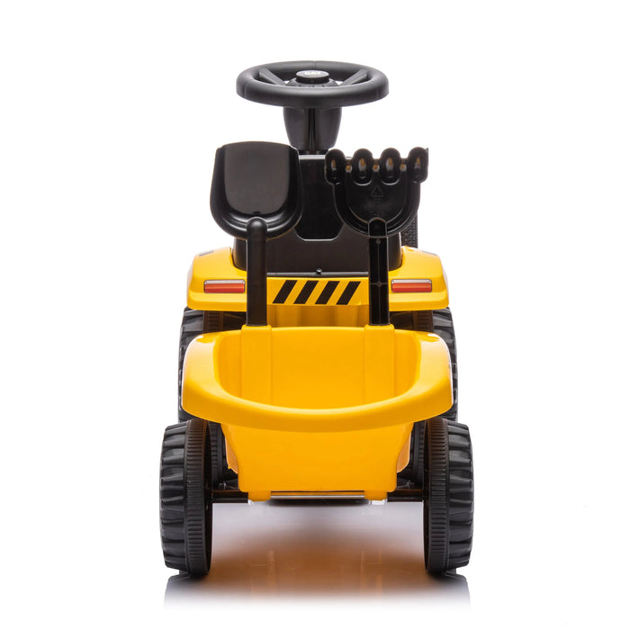Children’s yellow ride-on construction toy truck with black wheels and plastic tools shown on white background.