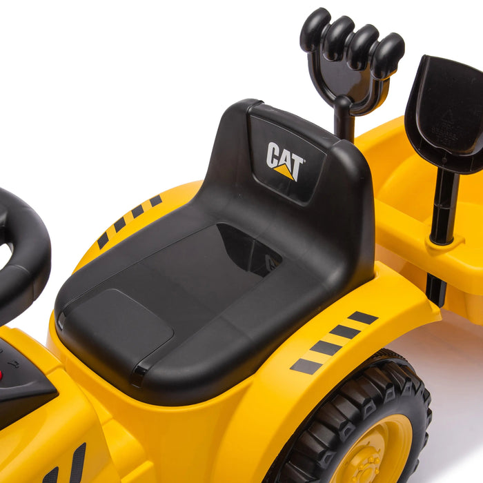 CAT ride-on construction toy with black seat and working shovel, shown on a white background.