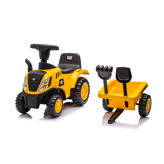 CAT yellow ride-on toy tractor with trailer, rake, and shovel shown on a white background.